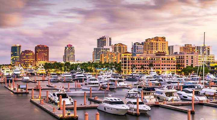 view of west palm beach marina filled with yachts during golden hour sunset